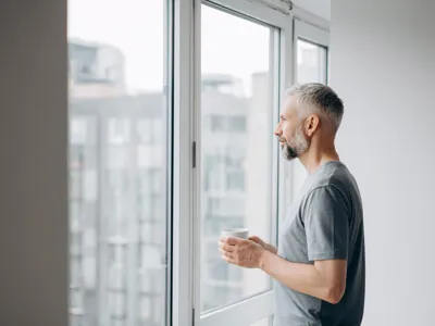 Man looking out of the window
